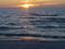 The setting sun reflecting on the water