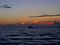 A boat, some gulls and the firey red sky