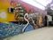 A mural on the side of a building on historic 8th Street in Pass-a-Grille.